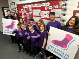 Ben McGovern, Ellie Harkins, Nalin Botterill and Philippa Lynas stand with primary school children (Image: Nil by Mouth) 