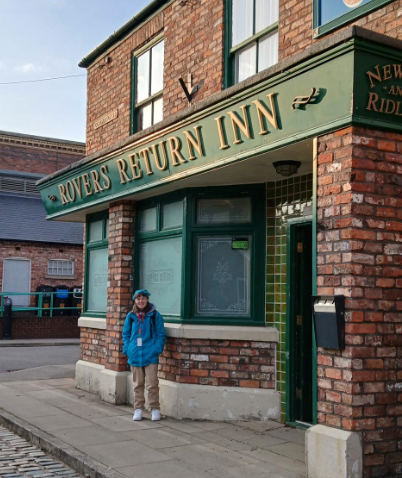 Laura outside Rovers Return Inn on the set of Coronation Street