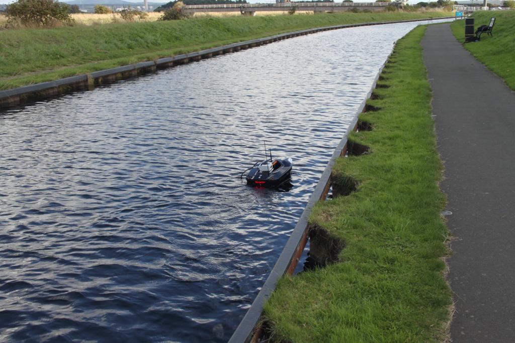 Aquabot, a water quality monitoring platform using digital sensor technology floating on a canal.