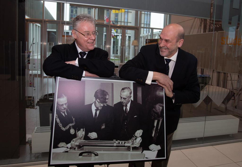 Two members of The Class of 69 in the atrium at Riverside.