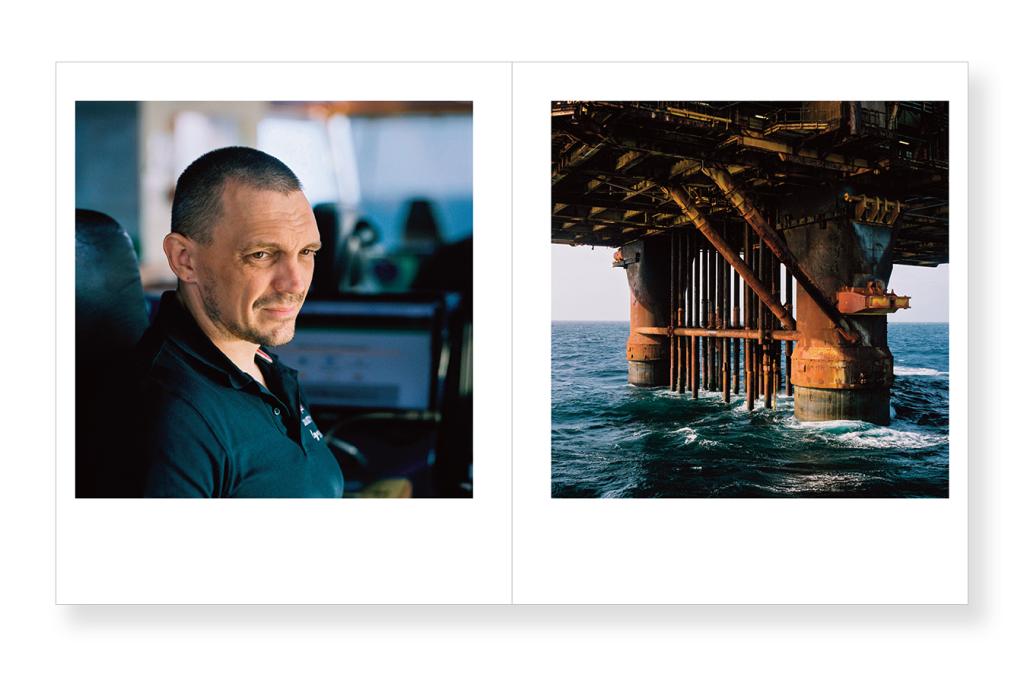 An offshore worker and the legs of a platform.