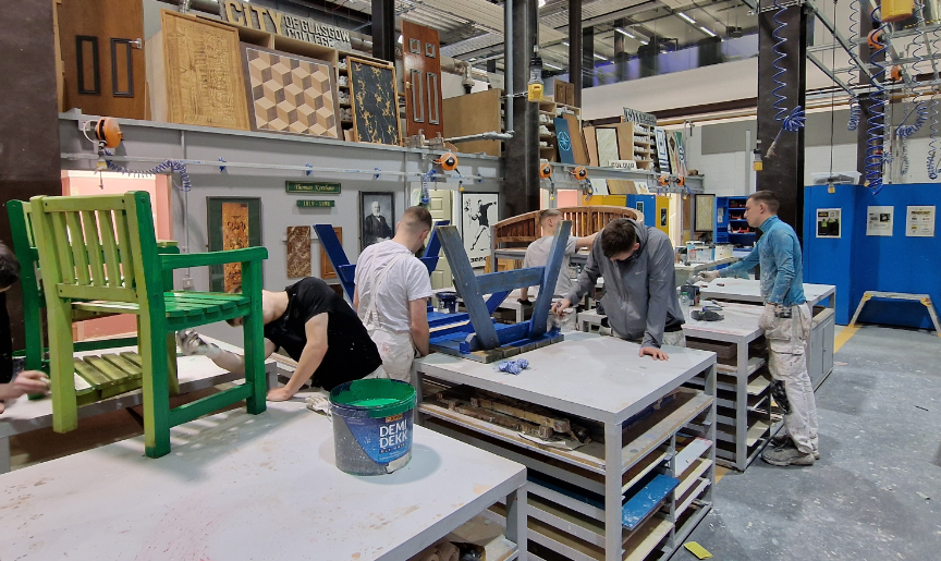 College students working on the hospice furniture.