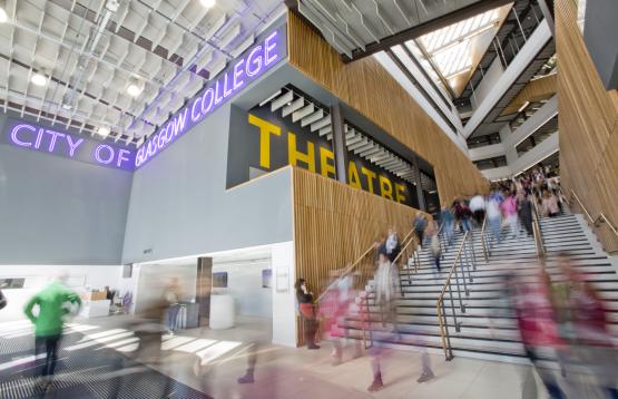 Image of college entrance with students blurred.