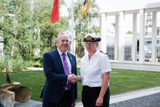 Principal and CEO, Paul Little shaking hands with Rear Admiral, Jude Terry OBE