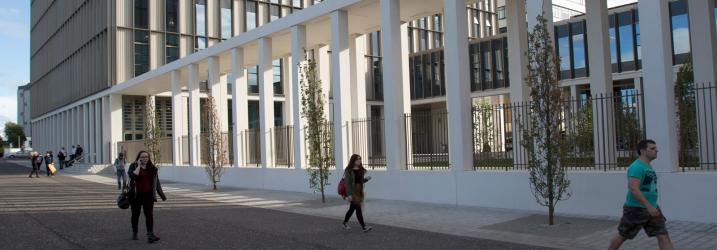 Students walking along a path at Riverside Campus.