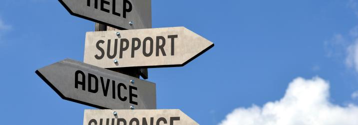 A signpost with signspinting different ways saying Help, Support, Advice and Guidance.